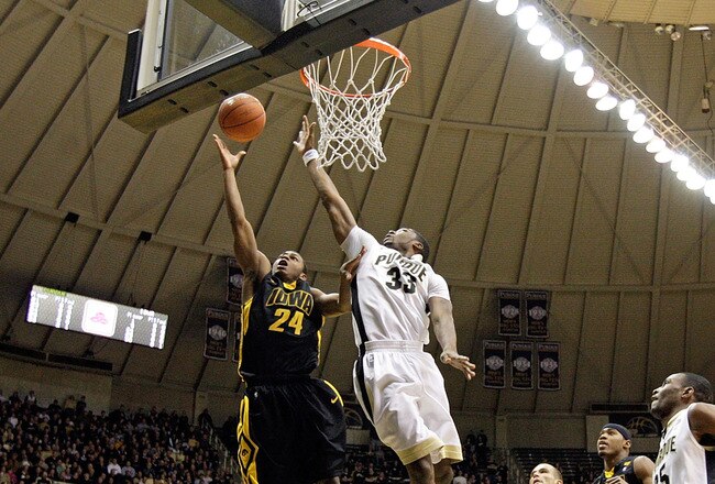 WEST LAFAYETTE, IN - JANUARY 09: Bryce Cartwright #24 of the Iowa Hawkeyes drives for a shot attempt against E'Twaun Moore #33 of the Purdue Boilermakers during the Big Ten Conference game at Mackey Arena on January 9, 2011 in West Lafayette, Indiana.  (Photo by Andy Lyons/Getty Images)