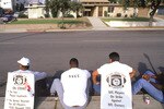 SEPTEMBER -1987: Members of the Los Angeles Raiders sit on the curb in a picket line during the NFL Players Union Strike on September,1987. (Photo by Mike Powell/Getty Images)