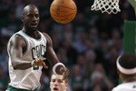 BOSTON, MA - MARCH 04: Kevin Garnett #5 of the Boston Celtics passes the ball to Paul Pierce #34 as David Lee #10 of the Golden State Warriors defends on March 4, 2011 at the TD Garden in Boston, Massachusetts.  The Celtics defeated the Warriors 107-103. NOTE TO USER: User expressly acknowledges and agrees that, by downloading and/or using this Photograph, User is consenting to the terms and conditions of the Getty Images License Agreement.  (Photo by Elsa/Getty Images)