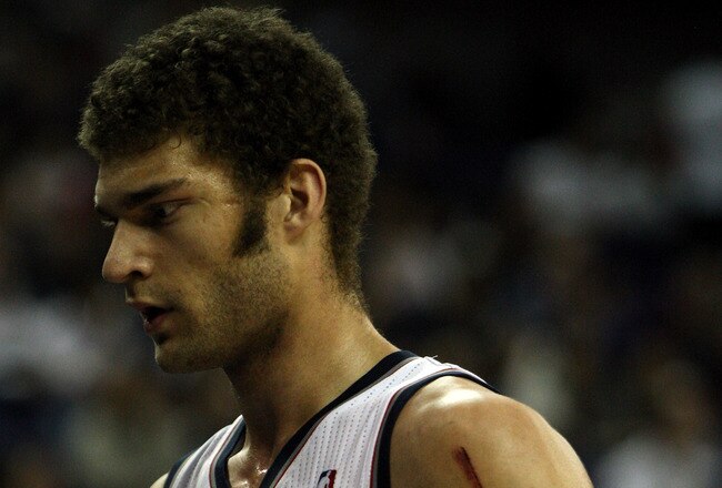LONDON, ENGLAND - MARCH 04:  Nets Captain, Brook Lopez #11 leaves the court during the NBA match between New Jersey Nets and the Toronto Raptors at the O2 Arena on March 4, 2011 in London, England. NOTE TO USER: User expressly acknowledges and agrees that, by downloading and/or using this Photograph, User is consenting to the terms and conditions of the Getty Images License Agreement.  (Photo by Warren Little/Getty Images)