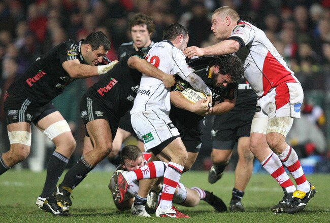 BELFAST, NORTHERN IRELAND - MARCH 04:  Alberto De Marchi of Aironi Rugby is tackled by Paddy Wallace and Tom Court of Ulster during the Magners League match between Ulster and Aironi at Ravenhill on March 04, 2011 in Belfast, Northern Ireland. (Photo by Patrick Bolger/Getty Images for Aironi)