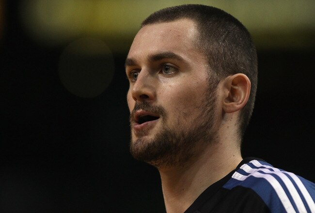 BOSTON, MA - JANUARY 03:  Kevin Love #42 of the Minnesota Timberwolves looks on before the game against the Boston Celtics on January 3, 2011 at the TD Garden in Boston, Massachusetts. NOTE TO USER: User expressly acknowledges and agrees that, by downloading and/or using this Photograph, User is consenting to the terms and conditions of the Getty Images License Agreement.  (Photo by Elsa/Getty Images)