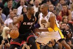 MIAMI, FL - MARCH 10:  Dwyane Wade #3 of the Miami Heat posts up Kobe Bryant #24 of the Los Angeles Lakers during a game at American Airlines Arena on March 10, 2011 in Miami, Florida. NOTE TO USER: User expressly acknowledges and agrees that, by downloading and/or using this Photograph, User is consenting to the terms and conditions of the Getty Images License Agreement.  (Photo by Mike Ehrmann/Getty Images)