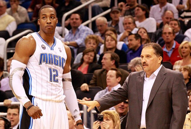 ORLANDO, FL - JANUARY 24:  Head coach Stan Van Gundy of the Orlando Magic talks with Dwight Howard #12 during the game against the Detroit Pistons at Amway Arena on January 24, 2011 in Orlando, Florida.  NOTE TO USER: User expressly acknowledges and agrees that, by downloading and or using this Photograph, user is consenting to the terms and conditions of the Getty Images License Agreement.  (Photo by Sam Greenwood/Getty Images)