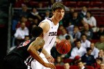 PHILADELPHIA, PA - DECEMBER 18:  Juan Fernandez #4 of the Temple Owls looks to pass the ball against Xavier Silas #13 of the Northern Illinois Huskies at the Liacouras Center on December 18, 2010 in Philadelphia, Pennsylvania.  (Photo by Chris Chambers/Getty Images)
