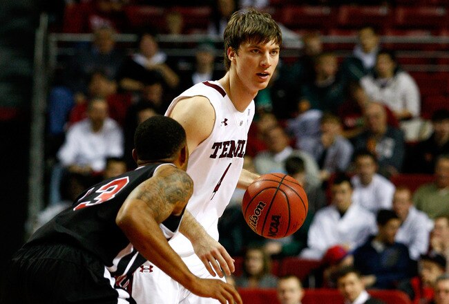 PHILADELPHIA, PA - DECEMBER 18:  Juan Fernandez #4 of the Temple Owls looks to pass the ball against Xavier Silas #13 of the Northern Illinois Huskies at the Liacouras Center on December 18, 2010 in Philadelphia, Pennsylvania.  (Photo by Chris Chambers/Getty Images)