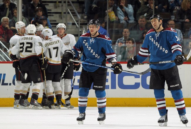 DENVER, CO - MARCH 11:  Ryan Getzlaf #15, Toni Lydman #32 and Lubomir Visnovsky #17 celebrate a third period goal by teammate Bobby Ryan #9 of t he Anaheim Ducks as Kevin Porter #12 and David Winnik #34 of the Colorado Avalanche skate off the ice during NHL action at the Pepsi Center on March 11, 2011 in Denver, Colorado. The Ducks defeated the Avalanche 6-2.  (Photo by Doug Pensinger/Getty Images)