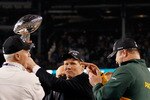 ARLINGTON, TX - FEBRUARY 06:  President and CEO of the Green Bay Packers Mark Murphy holds up the Vince Lombardi Trophy after winning Super Bowl XLV against the Pittsburgh Steelers 31-25 as Green Bay Packers General Manager Ted Thompson and head coach Mike McCarthy of the Green Bay Packers look on at Cowboys Stadium on February 6, 2011 in Arlington, Texas.  (Photo by Kevin C. Cox/Getty Images)