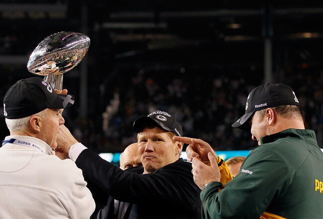 ARLINGTON, TX - FEBRUARY 06:  President and CEO of the Green Bay Packers Mark Murphy holds up the Vince Lombardi Trophy after winning Super Bowl XLV against the Pittsburgh Steelers 31-25 as Green Bay Packers General Manager Ted Thompson and head coach Mike McCarthy of the Green Bay Packers look on at Cowboys Stadium on February 6, 2011 in Arlington, Texas.  (Photo by Kevin C. Cox/Getty Images)