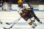 BOSTON - MARCH 20:  Melanie Gagnon #3 of the Minnesota Golden Gophers takes the puck from Valerie Chouinard #18 of the Mercyhurst Lakers on March 20, 2009 during the NCAA Womens Frozen Four at Agganis Arena in Boston, Massachusetts.  (Photo by Elsa/Getty Images)