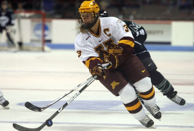 BOSTON - MARCH 20:  Melanie Gagnon #3 of the Minnesota Golden Gophers takes the puck from Valerie Chouinard #18 of the Mercyhurst Lakers on March 20, 2009 during the NCAA Womens Frozen Four at Agganis Arena in Boston, Massachusetts.  (Photo by Elsa/Getty Images)