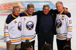 BUFFALO, NY - FEBRUARY 23:  New Buffalo Sabres owner Terry Pegula stands with former Sabres palyers Rene Robert #14, Rick Martin #7 and Gilbert Perrault #11  during pre game ceremonies prior to play against the Atlanta Thrashers at HSBC Arena on February 23, 2011 in Buffalo, New York.  (Photo by Rick Stewart/Getty Images)
