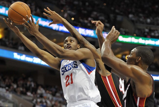 PHILADELPHIA - OCTOBER 27:  Thaddeus Young #21 of the Philadelphia 76ers lays up a shot past Udonis Haslem #40 and Chris Bosh #1 of the Miami Heat at the Wells Fargo Center on October 27, 2010 in Philadelphia, Pennsylvania. NOTE TO USER: User expressly acknowledges and agrees that, by downloading and or using this photograph, User is consenting to the terms and conditions of the Getty Images License Agreement. (Photo by Drew Hallowell/Getty Images)