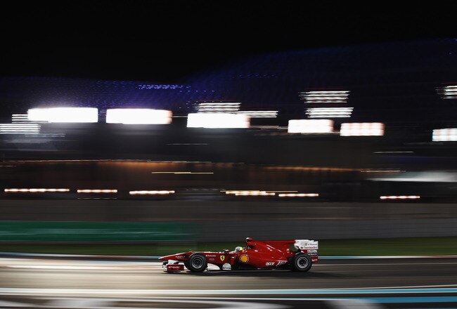 ABU DHABI, UNITED ARAB EMIRATES - NOVEMBER 14:  Felipe Massa of Brazil and Ferrari drives during the Abu Dhabi Formula One Grand Prix at the Yas Marina Circuit on November 14, 2010 in Abu Dhabi, United Arab Emirates.  (Photo by Mark Thompson/Getty Images)