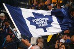 BUFFALO, NY - SEPTEMBER 25: Fans of the Toronto Maple Leafs wave a Maple Leaf flag while playing the Buffalo Sabres  at HSBC Arena on September 25, 2010 in Buffalo, New York.  (Photo by Rick Stewart/Getty Images)