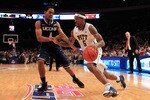 NEW YORK, NY - MARCH 10: Gilbert Brown #5 of the Pittsburgh Panthers dribbles past Jamal Coombs-McDaniel #4 of the Connecticut Huskies during the quarterfinals of the 2011 Big East Men's Basketball Tournament presented by American Eagle Outfitters  at Madison Square Garden on March 10, 2011 in New York City.  (Photo by Chris Trotman/Getty Images)