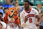 GREENSBORO, NC - MARCH 11:  Demontez Stitt #2 of the Clemson Tigers reacts as the Clemson Tiger mascot looks on while playing against the Boston College Eagles during the second half in the quarterfinals of the 2011 ACC men's basketball tournament at the Greensboro Coliseum on March 11, 2011 in Greensboro, North Carolina.  (Photo by Streeter Lecka/Getty Images)