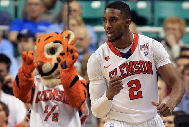 GREENSBORO, NC - MARCH 11:  Demontez Stitt #2 of the Clemson Tigers reacts as the Clemson Tiger mascot looks on while playing against the Boston College Eagles during the second half in the quarterfinals of the 2011 ACC men's basketball tournament at the Greensboro Coliseum on March 11, 2011 in Greensboro, North Carolina.  (Photo by Streeter Lecka/Getty Images)