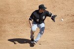 TUCSON, AZ - MARCH 07:  Infielder Brent Morel #22 of the Chicago White Sox fields a ground ball out against the Arizona Diamondbacks during the spring training game at Kino Veterans Memorial Stadium on March 7, 2011 in Tucson, Arizona. The charity game is to benefit the 9-year-old Christina-Taylor Green Memorial Fund.  Green was a victim of the Tucson shooting on January 8th.  (Photo by Christian Petersen/Getty Images)