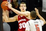LAS VEGAS - NOVEMBER 20:  Jon Leuer #30 of the Wisconsin Badgers looks to pass the ball inbounds as Derrick Jasper #5 of the UNLV Rebels defends during their game at the Thomas & Mack Center November 20, 2010 in Las Vegas, Nevada. UNLV won 68-65.  (Photo by Ethan Miller/Getty Images)