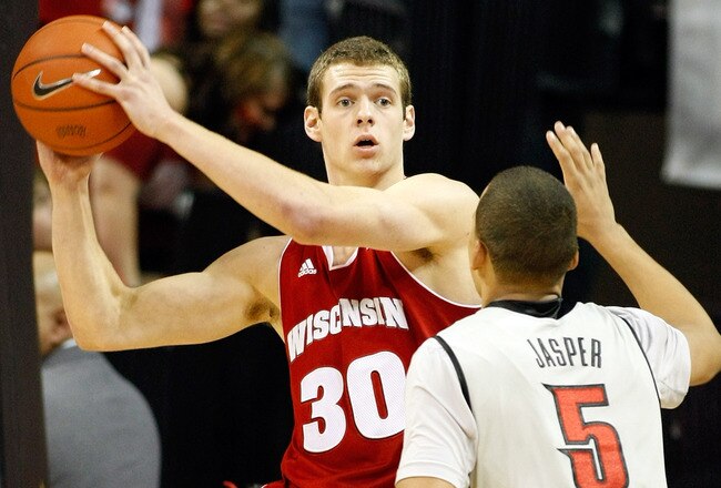 LAS VEGAS - NOVEMBER 20:  Jon Leuer #30 of the Wisconsin Badgers looks to pass the ball inbounds as Derrick Jasper #5 of the UNLV Rebels defends during their game at the Thomas & Mack Center November 20, 2010 in Las Vegas, Nevada. UNLV won 68-65.  (Photo by Ethan Miller/Getty Images)