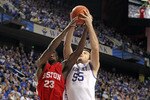 LEXINGTON, KY - NOVEMBER 30:  Josh Harrellson #55 of the Kentucky Wildcats and John Holland #23 of the Boston University Terriers battle for a rebound during the game on November 30, 2010 in Lexington, Kentucky. Kentucky won 91-57.  (Photo by Andy Lyons/Getty Images)