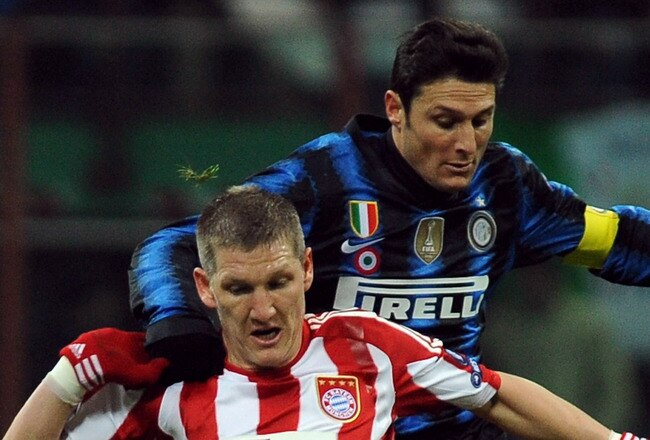 MILAN, ITALY - FEBRUARY 23:  Javier Zanetti of Inter Milan competes with Bastian Schweinsteiger (#31) of FC Bayern Muenchen during the UEFA Champions League round of 16 first leg match between Inter Milan v FC Bayern Muenchen on February 23, 2011 in Milan, Italy.  (Photo by Valerio Pennicino/Getty Images)