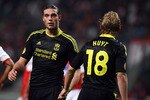 BRAGA, PORTUGAL - MARCH 10:  Andy Carroll of Liverpool with striking partner Dirk Kuyt of Liverpool  during the UEFA Europa League round of 16 first leg match between Braga and Liverpool at Estadio Municipal de Braga on March 10, 2011 in Braga, Portugal.  (Photo by Julian Finney/Getty Images)
