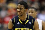 INDIANAPOLIS, IN - MARCH 12:  Darius Morris #4 of the Michigan Wolverines smiles as he looks on against the Ohio State Buckeyes during the semifinals of the 2011 Big Ten Men's Basketball Tournament at Conseco Fieldhouse on March 12, 2011 in Indianapolis, Indiana. Ohio State won 68-61.  (Photo by Andy Lyons/Getty Images)