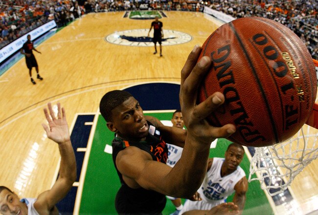 GREENSBORO, NC - MARCH 11: DeQuan Jones #31 of the Miami Hurricanes shoots against the North Carolina Tar Heels during the quarterfinals of the 2011 ACC men's basketball tournament at the Greensboro Coliseum on March 11, 2011 in Greensboro, North Carolina.  (Photo by Streeter Lecka/Getty Images)