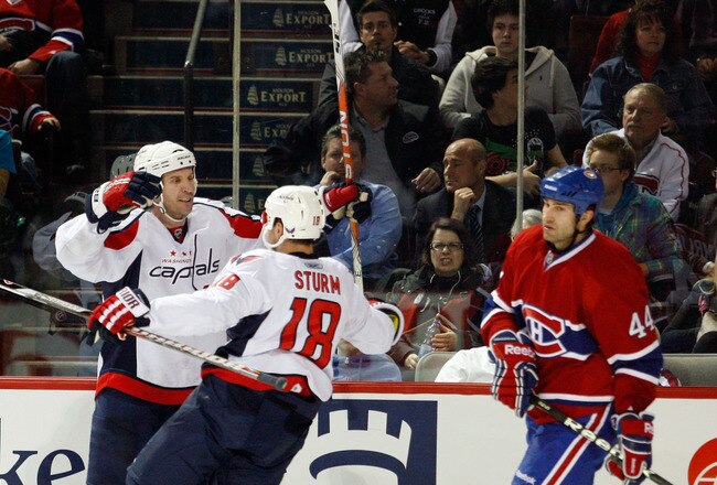 MONTREAL, CANADA - MARCH 15:  Mike Knuble #22 of the Washington Capitals celebrates his third period goal with team mate Marco Sturm #18 during the NHL game against the Montreal Canadiens at the Bell Centre on March 15, 2011 in Montreal, Quebec, Canada.  The Capitals defeated the Canadiens 4-2.  (Photo by Richard Wolowicz/Getty Images)