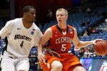 DAYTON, OH - MARCH 15: Tanner Smith #5 of the Clemson Tigers handles the ball against Jamarr Sanders #4 of the UAB Blazers during the first round of the 2011 NCAA men's basketball tournament at UD Arena on March 15, 2011 in Dayton, Ohio.  (Photo by Gregory Shamus/Getty Images)