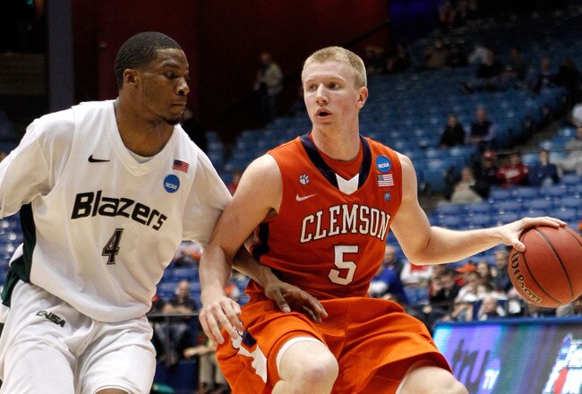 DAYTON, OH - MARCH 15: Tanner Smith #5 of the Clemson Tigers handles the ball against Jamarr Sanders #4 of the UAB Blazers during the first round of the 2011 NCAA men's basketball tournament at UD Arena on March 15, 2011 in Dayton, Ohio.  (Photo by Gregory Shamus/Getty Images)
