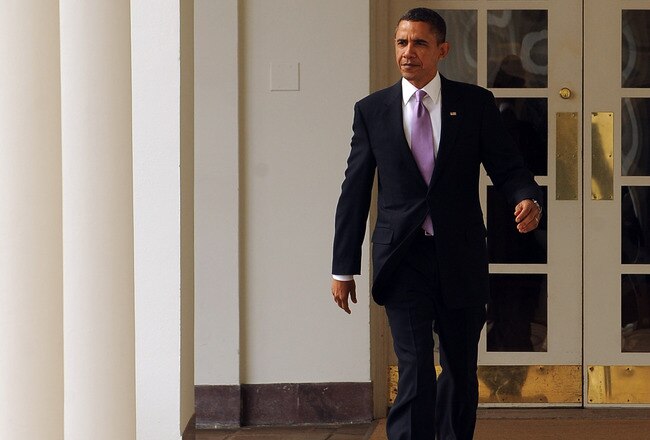 WASHINGTON, DC - JANUARY 25:  (AFP OUT) U.S. President Barack Obama walks through the Colonnade of the Rose Garden of the White House on January 25, 2011 in Washington, DC. Later this evening Obama will give his State of the Union Address to the Joint Session of Congress.  (Photo by Roger L. Wollenberg-Pool/Getty Images)