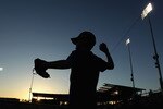 GLENDALE, AZ - MARCH 04:  A fan of the Los Angeles Dodgers plays catch in the outfield before the spring training game against the San Francisco Giants at Camelback Ranch on March 4, 2011 in Glendale, Arizona.  (Photo by Christian Petersen/Getty Images)