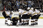 PITTSBURGH, PA - MARCH 07:  Marc Savard #91 of the Boston Bruins lies injured on the ice against the Pittsburgh Penguins in the third period at Mellon Arena on March 7, 2010 in Pittsburgh, Pennsylvania.  The Penguins defeated the Bruins 2-1.  (Photo by Justin K. Aller/Getty Images)