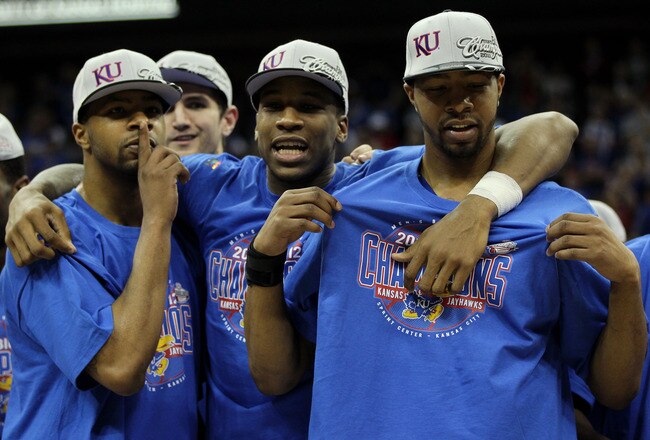KANSAS CITY, MO - MARCH 12:  (L-R) Marcus Morris #22, Thomas Robinson #0 and Markieff Morris #21 of the Kansas Jayhawks celebrate after defeating the Texas Longhorns 85-73 to win the 2011 Phillips 66 Big 12 Men's Basketball Tournament championship game at Sprint Center on March 12, 2011 in Kansas City, Missouri.  (Photo by Jamie Squire/Getty Images)