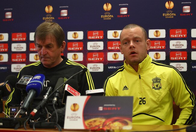 LIVERPOOL, ENGLAND - MARCH 16:  Liverpool manager Kenny Dalglish listens as Jay Spearing answers a question during a press conference ahead of their UEFA Europa League Round of 16 second leg match against Braga at Melwood Training Ground on March 16, 2010 in Liverpool, England.  (Photo by Clive Brunskill/Getty Images)