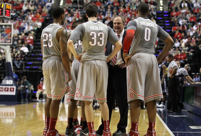 INDIANAPOLIS, IN - MARCH 13:  Head coach Thad Matta of the Ohio State Buckeyes talks with his players during a timeout including David Lighty #23, Jon Diebler #33 and Jared Sullinger #0 against the Penn State Nittany Lions during the championship game of the 2011 Big Ten Men's Basketball Tournament at Conseco Fieldhouse on March 13, 2011 in Indianapolis, Indiana. Ohio State won 71-60. (Photo by Andy Lyons/Getty Images)