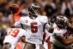 NEW ORLEANS, LA - JANUARY 02:  Quarterback Josh Freeman #5  of the Tampa Bay Buccaneers throws the ball during the game against the New Orleans Saints at the Louisiana Superdome on January 2, 2011 in New Orleans, Louisiana.  (Photo by Chris Graythen/Getty Images)
