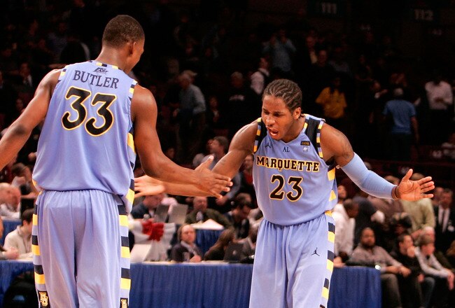 NEW YORK, NY - MARCH 09: Dwight Buycks #23 and Jimmy Butler #33 of the Marquette Golden Eagles celebrate late in the second half against the West Virginia Mountaineers during the second round of the 2011 Big East Men's Basketball Tournament presented by American Eagle Outfitters at Madison Square Garden on March 9, 2011 in New York City.  (Photo by Mike Lawrie/Getty Images)