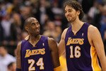 DALLAS, TX - MARCH 12:  Kobe Bryant #24 and Pau Gasol #16 of the Los Angeles Lakers react after a 96-91 win against the Dallas Mavericks at American Airlines Center on March 12, 2011 in Dallas, Texas.  NOTE TO USER: User expressly acknowledges and agrees that, by downloading and or using this photograph, User is consenting to the terms and conditions of the Getty Images License Agreement.  (Photo by Ronald Martinez/Getty Images)