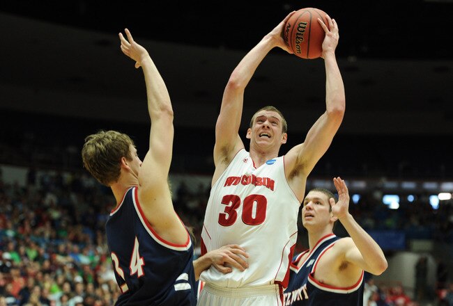 TUCSON, AZ - MARCH 17:  Jon Leuer #30 of the Wisconsin Badgers goes up against Mick Hedgepeth #34 and Trevor Noack #30 of the Belmont Bruins during the second round of the 2011 NCAA men's basketball tournament at McKale Center on March 17, 2011 in Tucson, Arizona.  (Photo by Harry How/Getty Images)