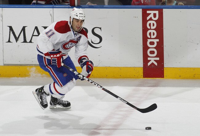 SUNRISE, FL - MARCH 3: Scott Gomez #11 of the Montreal Canadiens skates with the puck against the Florida Panthers on March 3, 2011 at the BankAtlantic Center in Sunrise, Florida. The Canadiens defeated the Panthers 4-0. (Photo by Joel Auerbach/Getty Images)