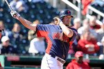 GOODYEAR, AZ - FEBRUARY 27:  Travis Buck #28 of the Cleveland Indians watches the ball after hitting it down the first base line against the Cincinnati Reds at Goodyear Ballpark on February 27, 2011 in Goodyear, Arizona.  (Photo by Norm Hall/Getty Images)