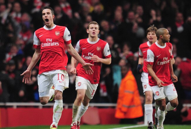 LONDON, ENGLAND - FEBRUARY 16:  Robin van Persie of Arsenal celebrates Arsenal's first goal during the UEFA Champions League round of 16 first leg match between Arsenal and Barcelona at the Emirates Stadium on February 16, 2011 in London, England.  (Photo by Shaun Botterill/Getty Images)
