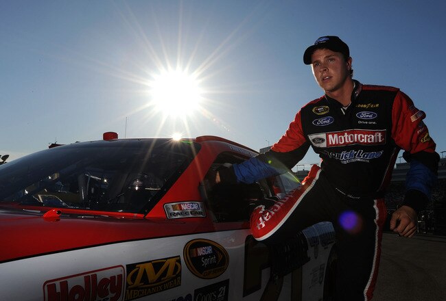 LAS VEGAS, NV - MARCH 04:  Trevor Bayne, driver of the #21 Motorcraft/Quick Lane Tire & Auto Center Ford, stands next to his car after qualifying for the NASCAR Sprint Cup Series Kobalt Tools 400 at Las Vegas Motor Speedway on March 4, 2011 in Las Vegas, Nevada.  (Photo by Jared C. Tilton/Getty Images for NASCAR)