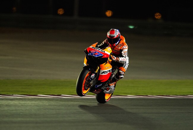 DOHA, QATAR - MARCH 17:  Casey Stoner of Australia and Repsol Honda Team  lifts the front wheel during the free practice of Doha GP at Losail Circuit on March 17, 2011 in Doha, Qatar.  (Photo by Mirco Lazzari gp/Getty Images)