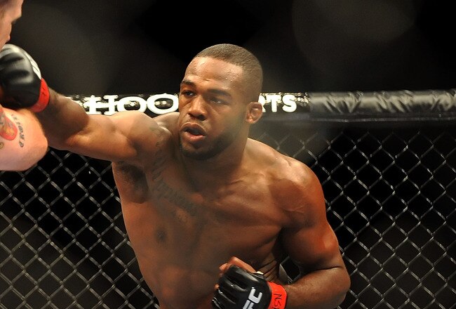 LAS VEGAS - JULY 11:  (R-L) Jon Jones connects with a right punch on Jake O'Brein during their light heavyweight bout during UFC 100 on July 11, 2009 in Las Vegas, Nevada. Jones defeated O'Brein by second round tapout.  (Photo by Jon Kopaloff/Getty Images)