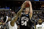 WASHINGTON - MARCH 19:  Matt Howard #54 of the Butler Bulldogs tries to put a shot over Nasir Robinson #35 of the Pittsburgh Panthers during the third round of the 2011 NCAA men's basketball tournament at Verizon Center on March 19, 2011 in Washington, DC.  (Photo by Rob Carr/Getty Images)